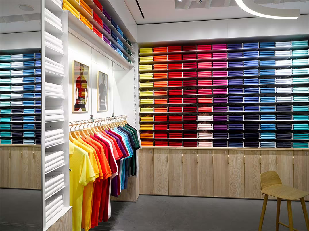Lacoste boutique wall of colourful polo shirts